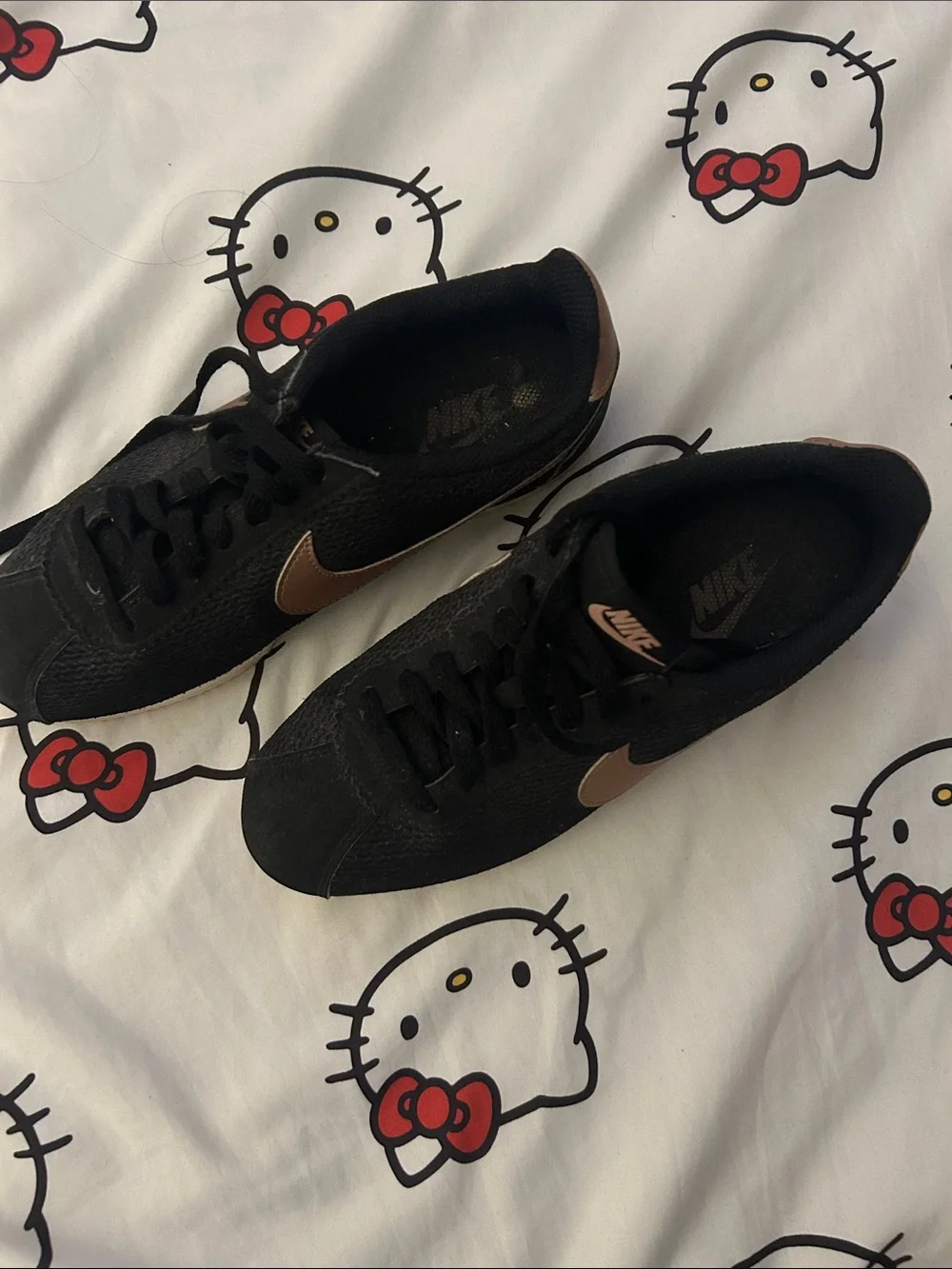 Nike Black Low-Top Sneakers with Bronze Swoosh